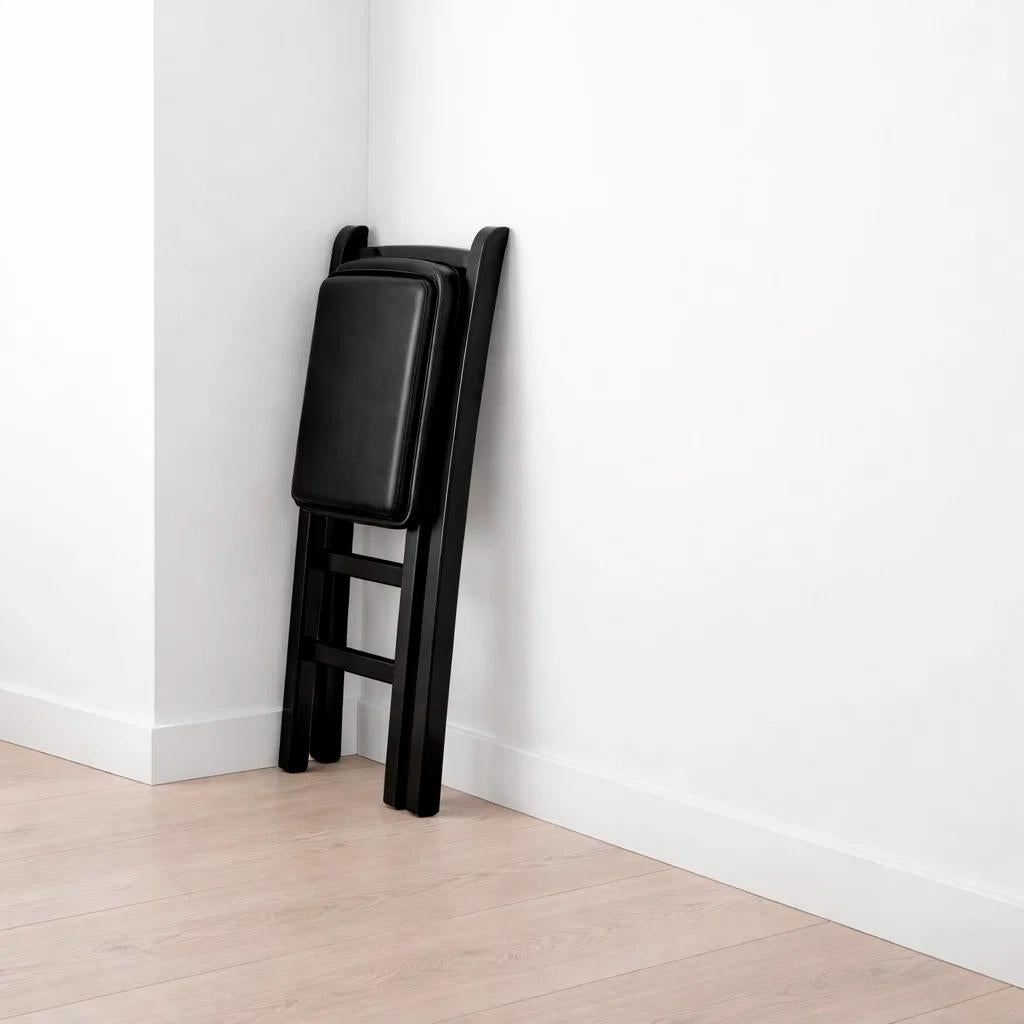 Silla Industrial Plegable con Marco Negro y Tapizado Sintético